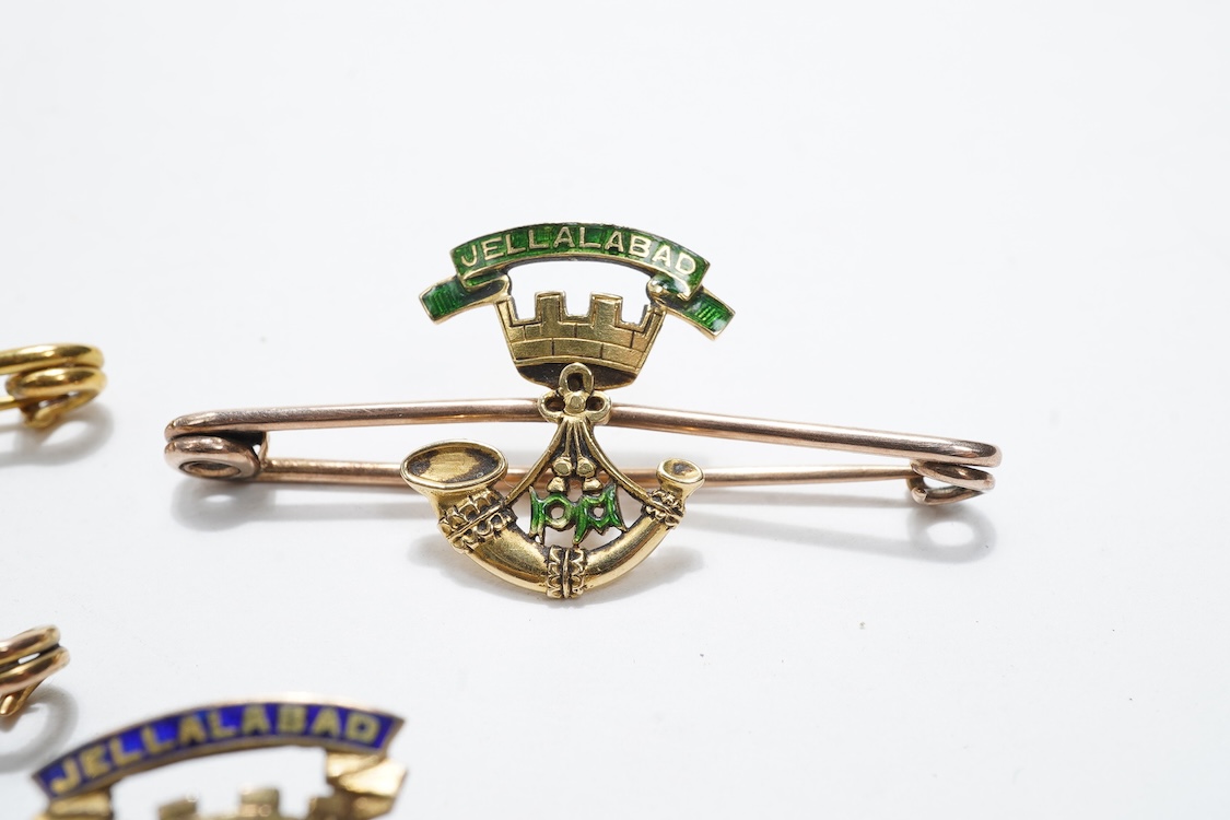 Four sweetheart type brooches; a hallmarked 9ct gold example with an enamel coat of arms, together with three yellow metal military brooches; all Prince Albert’s Somerset Light Infantry, two with enamelled ‘Jellalabad PA